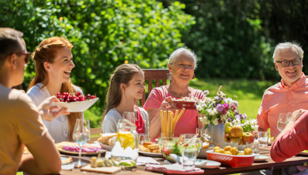 happy family having festive dinner or summer garden party