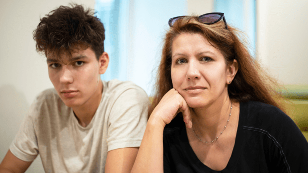 web2-a-middle-aged-woman-with-his-teenage-son-resting-at-the-cafe-and-talking-about-teenage-problems.-mom-has-fun-but-the-son-is-very-serious-shutterstock_1441155383.png