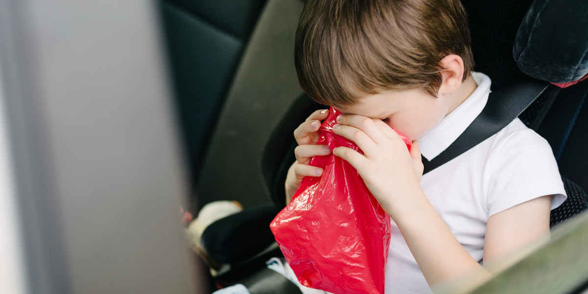 child vomiting in car