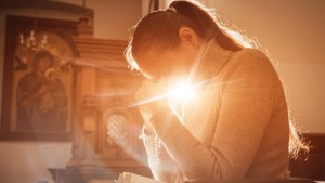 Web3-Christian-woman-praying-in-church