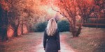 woman walks in the park in autumn