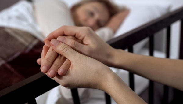 Daughter supporting her terminally ill mother