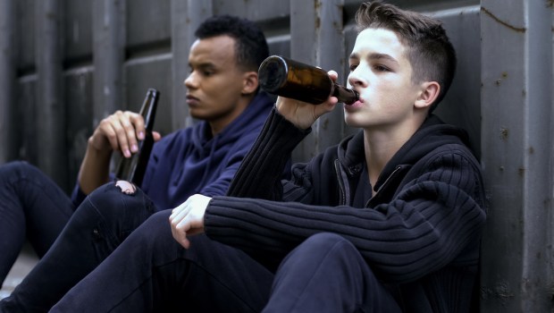teenager guys drinking beer