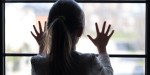 young girl at window
