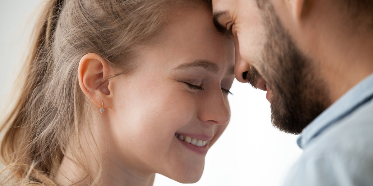 WEB2 -Close up of loving man and woman touching forehead having sweet tender moment together, happy millennial couple smile caressing each other, young husband and wife enjoy tenderness at home – shutterstock_1230899386.jpg