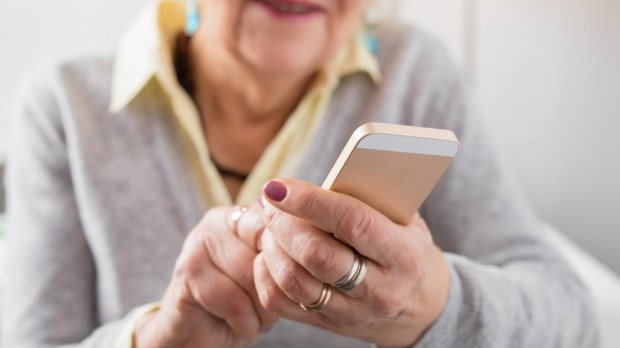 old-person-phone-covid-shutterstock_585622256.jpg