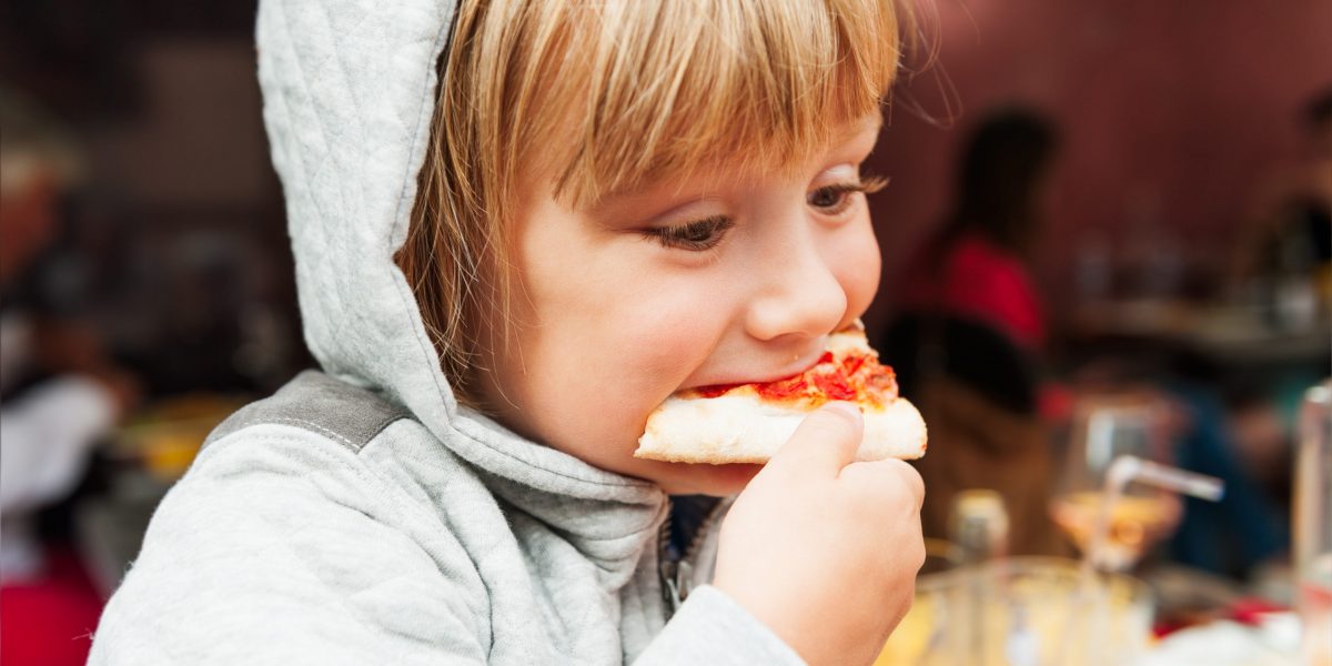 CHILD EATING PIZZA