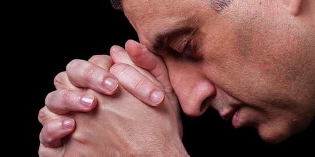 MATURE MAN PRAYING,