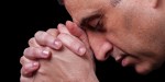 MATURE MAN PRAYING,