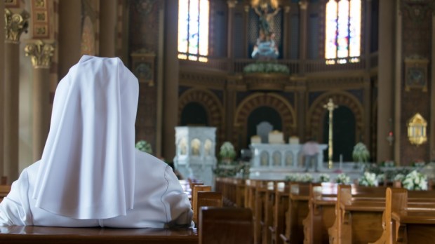 web3-nun-prayer-solitary-isolation-church-milkovasa-shutterstock.jpg