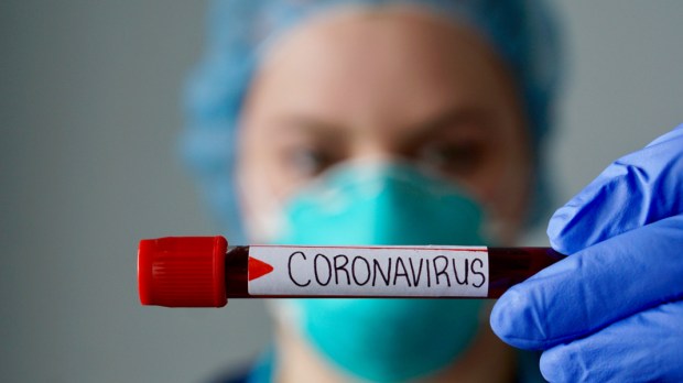 web3-nurse-wearing-respirator-mask-holding-a-positive-blood-test-result-for-the-new-rapidly-spreading-coronavirus-originating-in-wuhan-china-shutterstock_1625317096.jpg
