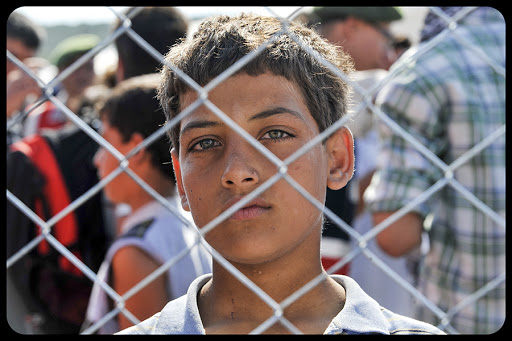 Syrian sad child in refugee camp © Thomas Koch / Shutterstock.com – ar