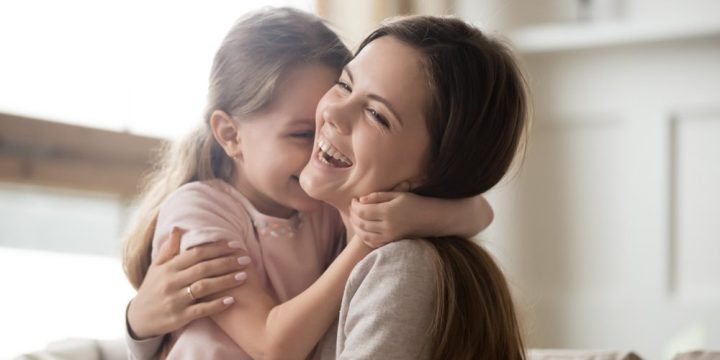 MOTHER DAUGHTER LAUGHING