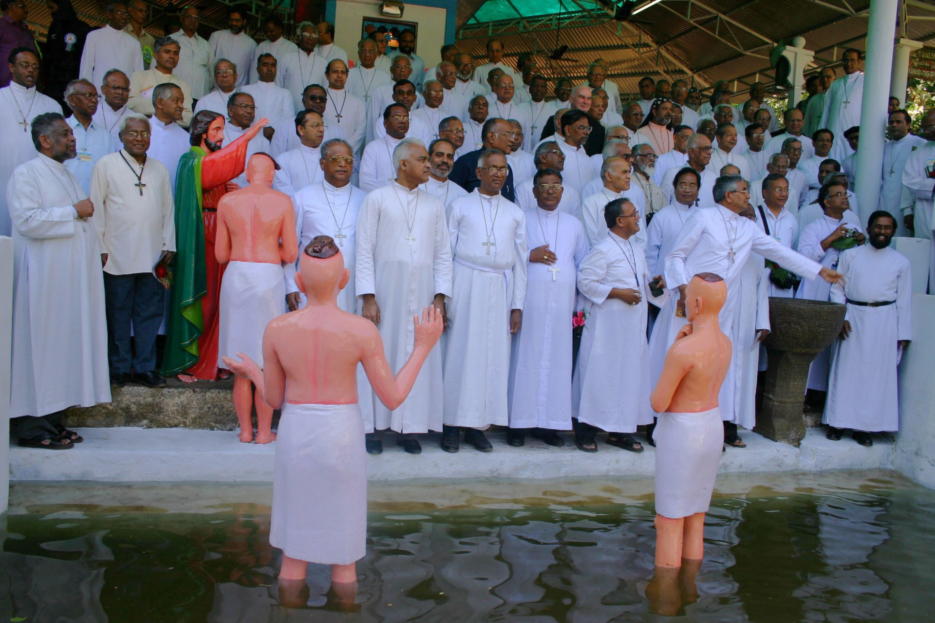 6.-CBCI-delegates-of-2004-posinga-thte-Baptism-pond-at-the-shrine.jpg