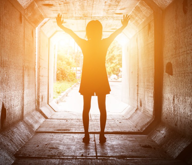 WOMAN, TUNNEL, LIGHT