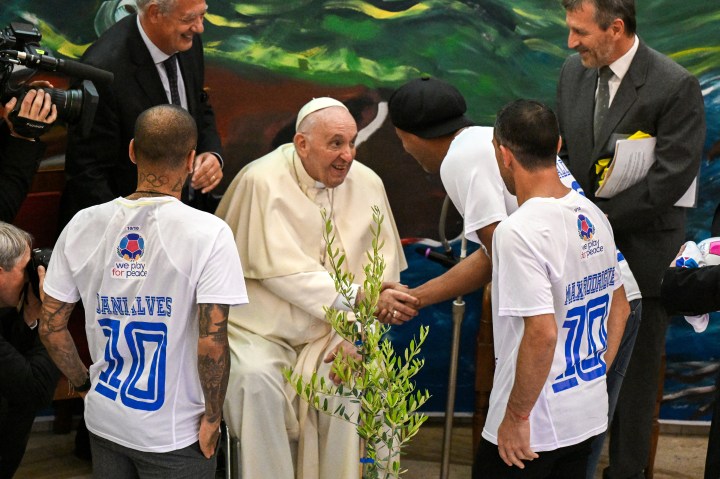 Pope-Francis-wheelchair-greets-Brazilian-footballer-Ronaldinho-and-Dani-Alves-and-Argentinian-footballer-Maxi-Rodriguez-AFP
