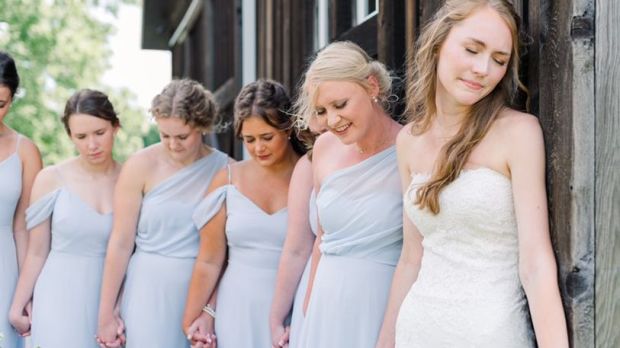 BRIDAL PARTY PRAYING