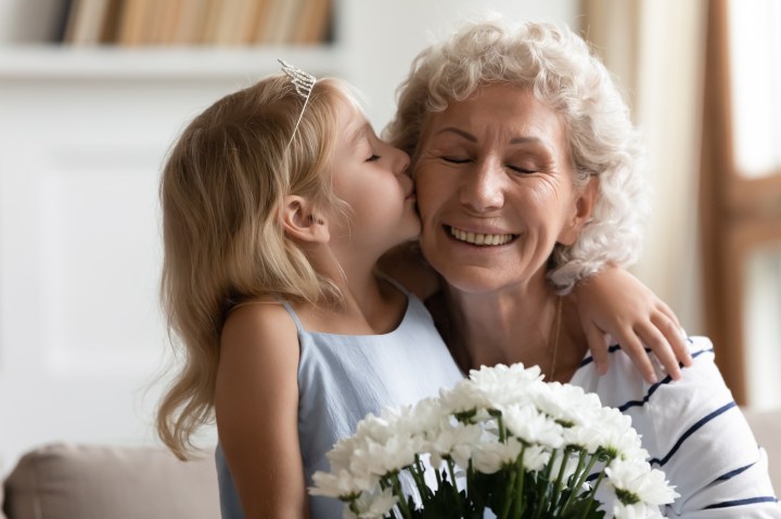 flowers-child-elder-woman-kiss.jpg