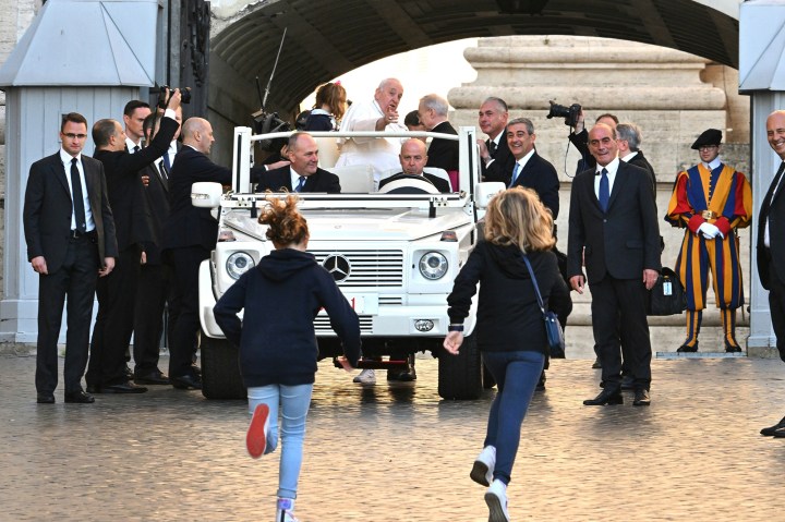 Pope-Francis-waves-as-he-arrives-for-the-weekly-general-audience-AFP
