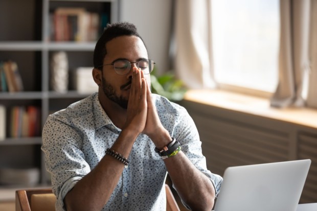 man praying at work, prayer before beginning work, sanctify daily work