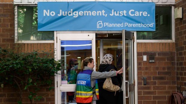 PEOPLE ENTERING ABORTION CLINIC