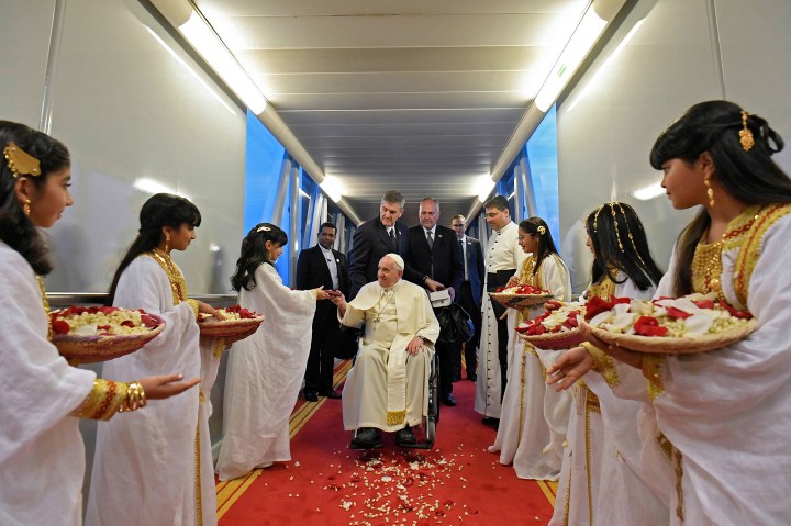 Pope-Francis-being-greeted-as-he-disembarks-off-his-plane-upon-arriving-in-Bahrains-capital-Manama-on-November-3-2022-AFP