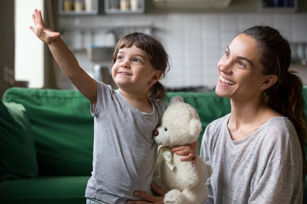 Young girl and mom looking forward to good future