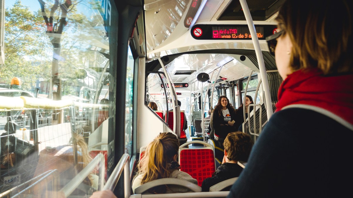 People in a bus in a city