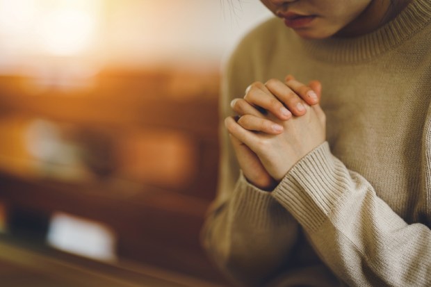 Holding hands in prayer