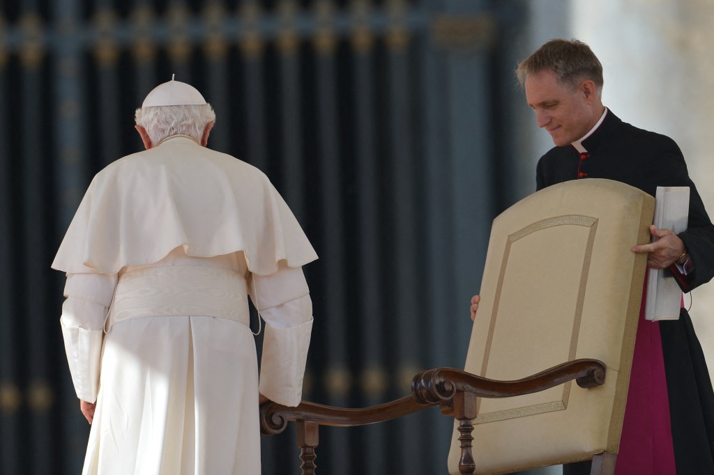 Pope-Benedict-XVI-is-assisted-by-his-secretary-Georg-Gaenswein-AFP