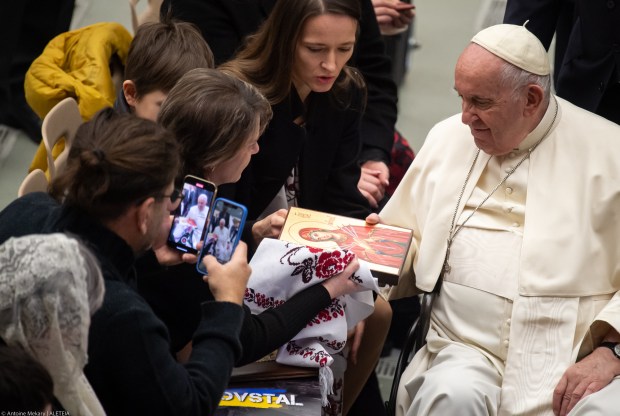 Pope Francis receives a gift from Yuliya Fedosiuk, wife of Azov battalion fighter Arseniy Fedosiuk