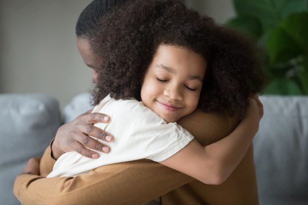 little kid girl hugging cuddling bonding at home