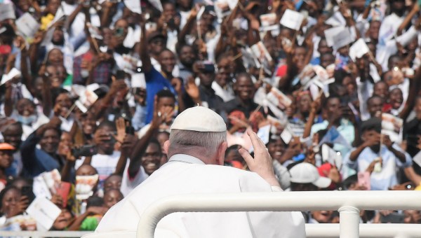 Pope-Francis-waves-as-he-arrives-by-popemobile-for-a-meeting-with-young-people-and-catechists-at-Martyrs-Stadium-in-Kinshasa-AFP