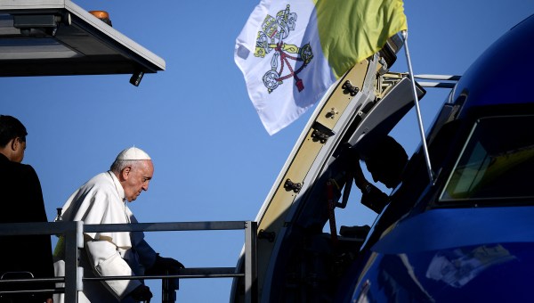 Pope Francis arrives at Rome's Fiumicino airport to board his plane for his trip to Hungary