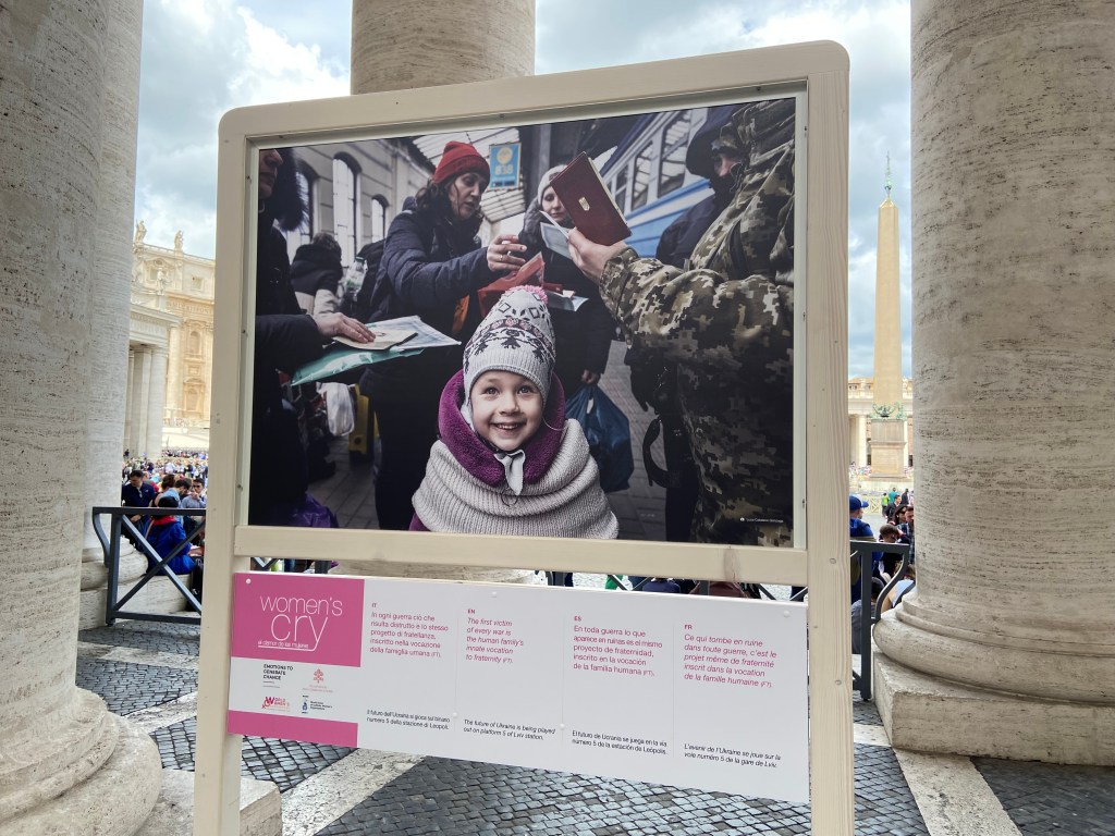 One of the photos in the exhibit "Women's Cry" showing a Ukrainian girl fleeing the war at a train station.