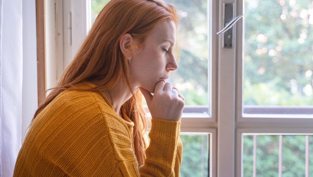 PRAY-HOME-WOMAN-shutterstock_2180361431.jpg