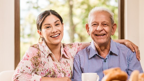 young-woman-elderly-man-smiling-happy