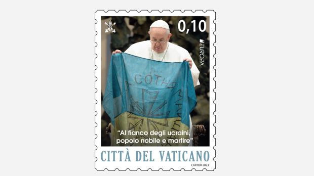 Stamp showing Pope Francis holding a Ukrainian flag during a general audience in April 2022. The flag came from the city of Bucha where many civilians died.