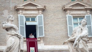 Pope Francis addresses worshippers during his Angelus prayer from the window of the Apostolic Palace