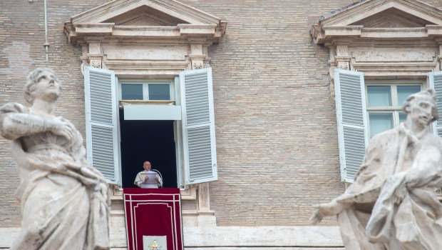 Pope Francis addresses worshippers during his Angelus prayer from the window of the Apostolic Palace