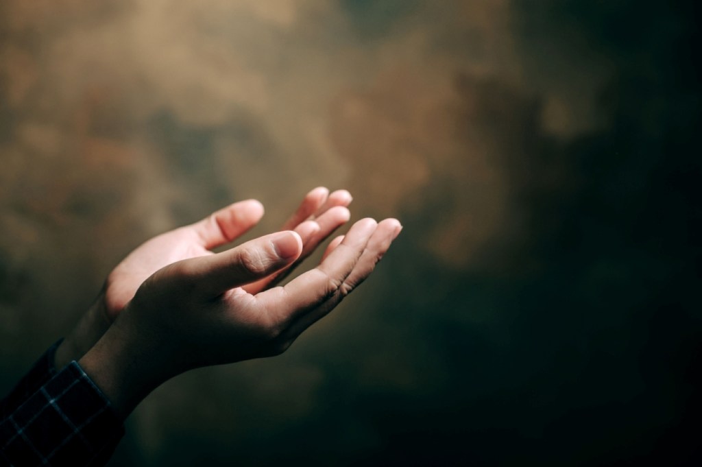 praying hands with faith in religion and belief in God