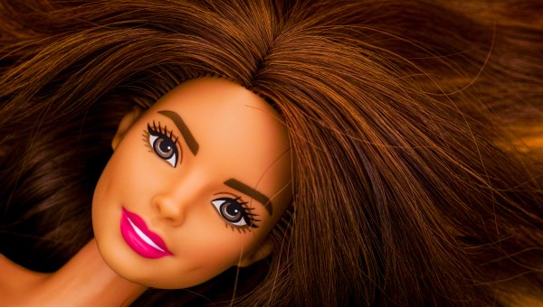 Portrait of Barbie doll with brown hair. Studio shot.