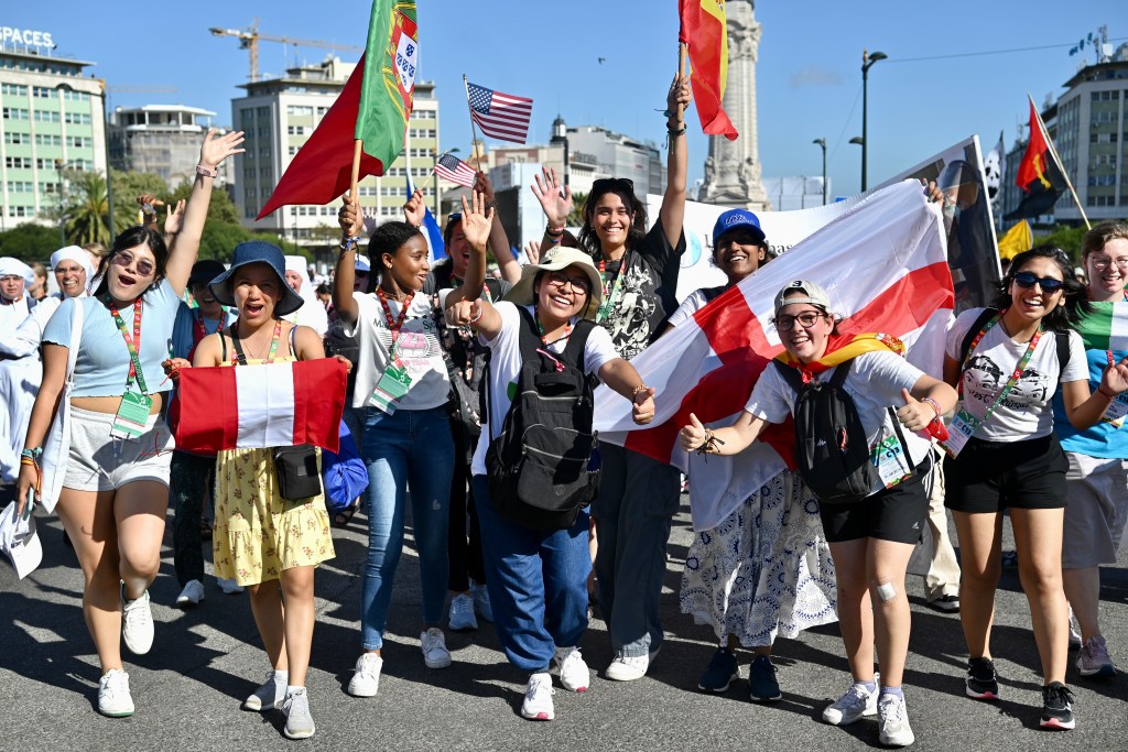 Pilgrims attend the opening mass of the World Youth Day 2023