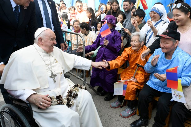 people greeting Pope Francis upon his arrival at the Apostolic Prefecture of Ulaanbaatar