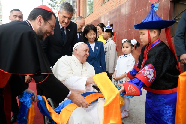 children greeting Pope Francis upon his arrival at the Apostolic Prefecture of Ulaanbaatar