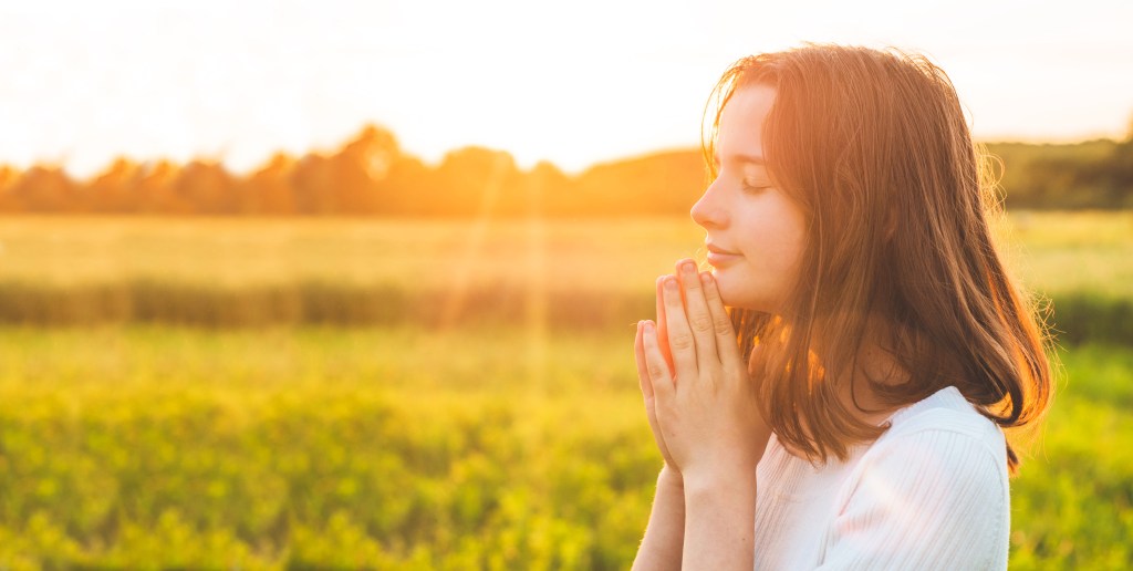 PRAY-OUTSIDE-GIRL-shutterstock_1438888781