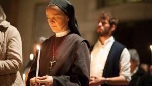 Nun holds candle East Jerusalem 2024