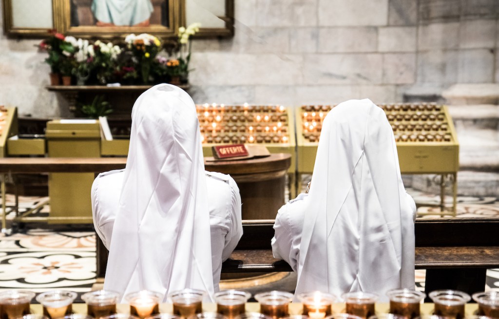 Nuns praying in church