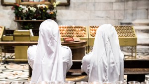 Nuns praying in church