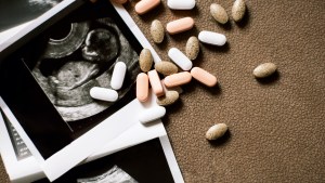 Pills and ultrasound images of baby